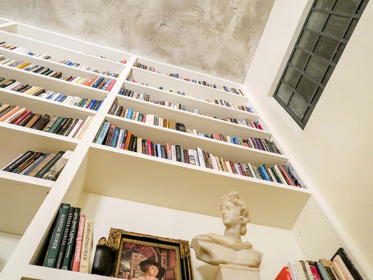 furniture low angle photo of assorted book on bookshelf bookcase